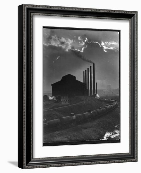 Massive Otis Steel Mill Surrounded by Tanker Cars on Railroad Track on a Cloudy Day-Margaret Bourke-White-Framed Premium Photographic Print