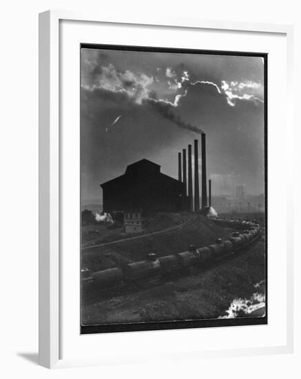 Massive Otis Steel Mill Surrounded by Tanker Cars on Railroad Track on a Cloudy Day-Margaret Bourke-White-Framed Premium Photographic Print