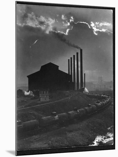 Massive Otis Steel Mill Surrounded by Tanker Cars on Railroad Track on a Cloudy Day-Margaret Bourke-White-Mounted Premium Photographic Print