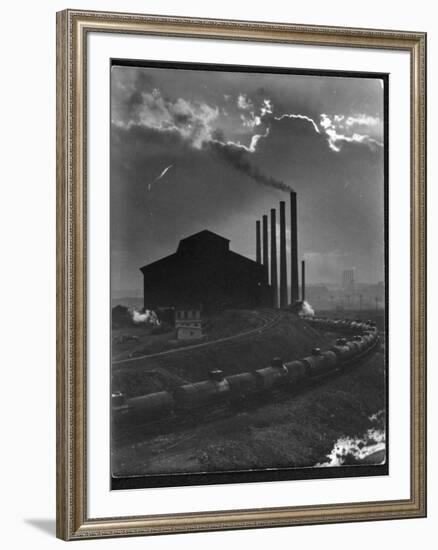 Massive Otis Steel Mill Surrounded by Tanker Cars on Railroad Track on a Cloudy Day-Margaret Bourke-White-Framed Premium Photographic Print