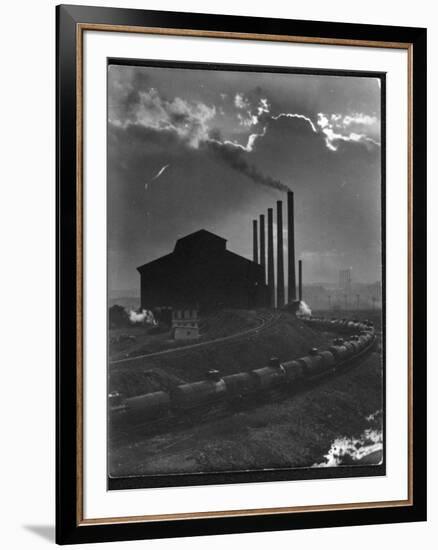 Massive Otis Steel Mill Surrounded by Tanker Cars on Railroad Track on a Cloudy Day-Margaret Bourke-White-Framed Premium Photographic Print