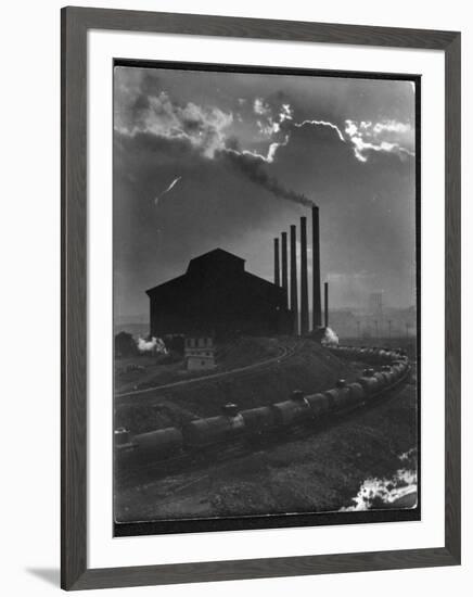 Massive Otis Steel Mill Surrounded by Tanker Cars on Railroad Track on a Cloudy Day-Margaret Bourke-White-Framed Premium Photographic Print