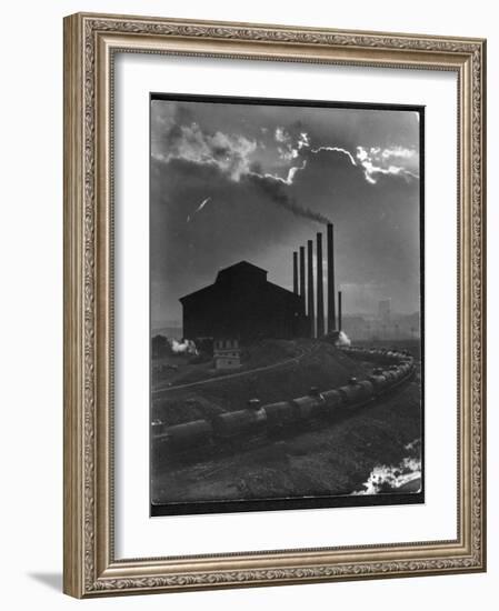 Massive Otis Steel Mill Surrounded by Tanker Cars on Railroad Track on a Cloudy Day-Margaret Bourke-White-Framed Photographic Print