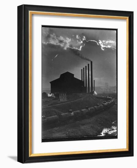 Massive Otis Steel Mill Surrounded by Tanker Cars on Railroad Track on a Cloudy Day-Margaret Bourke-White-Framed Photographic Print