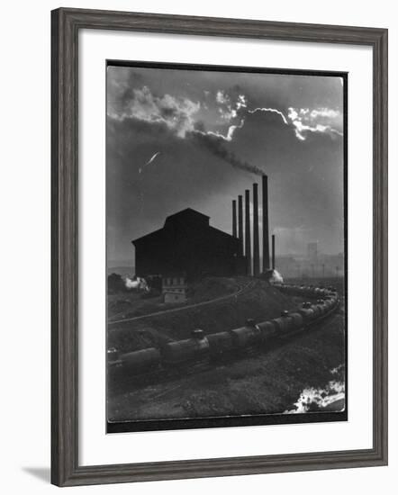 Massive Otis Steel Mill Surrounded by Tanker Cars on Railroad Track on a Cloudy Day-Margaret Bourke-White-Framed Photographic Print