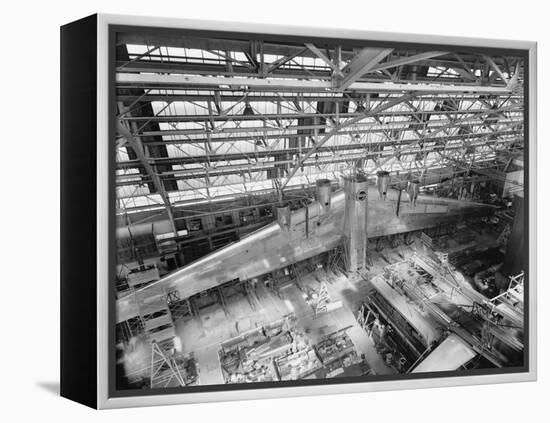 Massive Wing of a B-19 Bomber under Construction in a During World War 2 in 1941-null-Framed Stretched Canvas