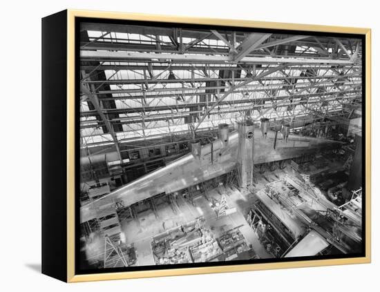 Massive Wing of a B-19 Bomber under Construction in a During World War 2 in 1941-null-Framed Stretched Canvas