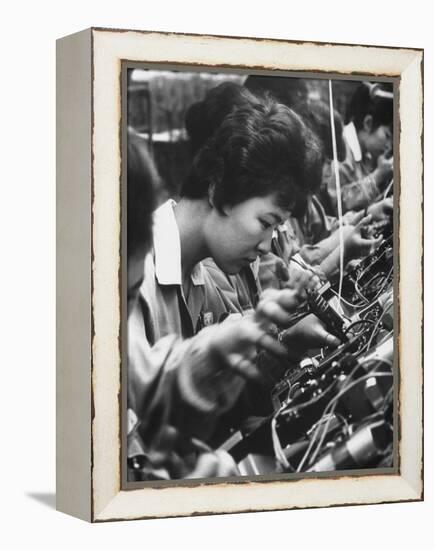 Matsushita Electronics Corp. Women Employees Working in a Factory-Bill Ray-Framed Premier Image Canvas