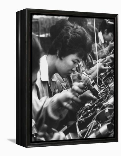 Matsushita Electronics Corp. Women Employees Working in a Factory-Bill Ray-Framed Premier Image Canvas