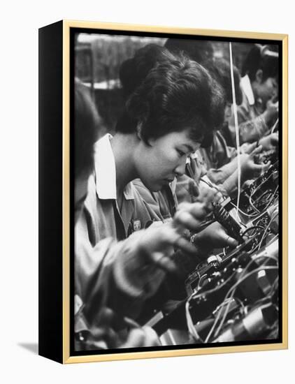 Matsushita Electronics Corp. Women Employees Working in a Factory-Bill Ray-Framed Premier Image Canvas