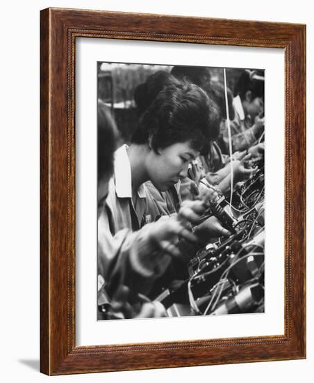 Matsushita Electronics Corp. Women Employees Working in a Factory-Bill Ray-Framed Photographic Print