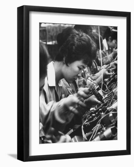 Matsushita Electronics Corp. Women Employees Working in a Factory-Bill Ray-Framed Photographic Print