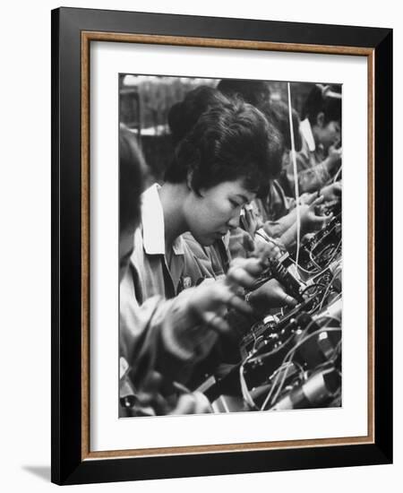 Matsushita Electronics Corp. Women Employees Working in a Factory-Bill Ray-Framed Photographic Print