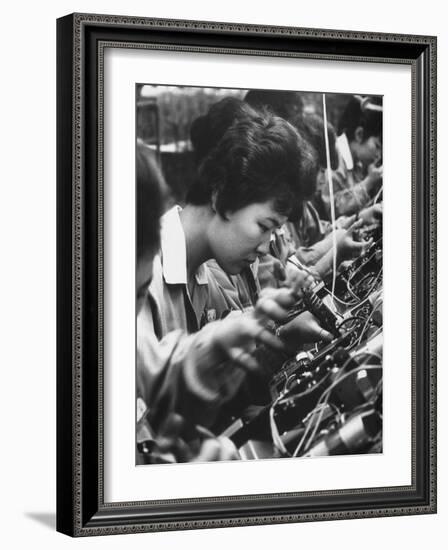 Matsushita Electronics Corp. Women Employees Working in a Factory-Bill Ray-Framed Photographic Print