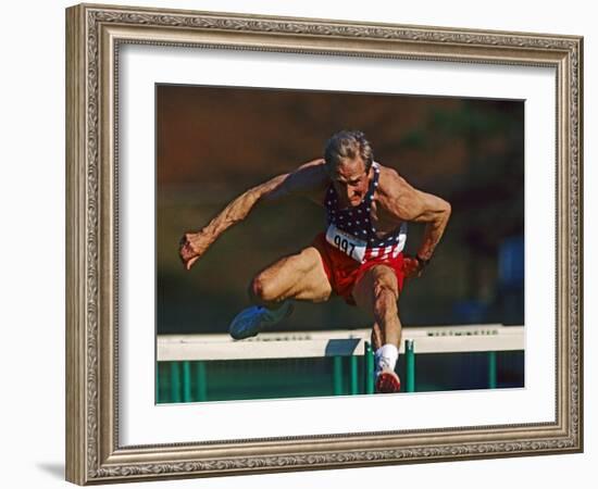 Mature Athlete Competes in Hurdles Race, Atlanta, Georgia, USA-Paul Sutton-Framed Photographic Print