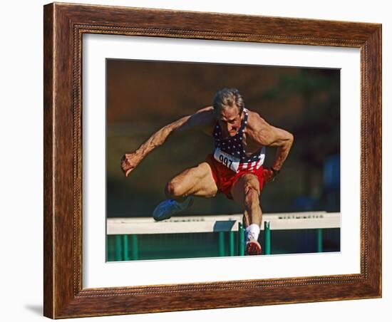 Mature Athlete Competes in Hurdles Race, Atlanta, Georgia, USA-Paul Sutton-Framed Photographic Print