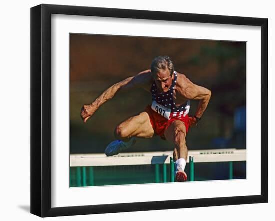 Mature Athlete Competes in Hurdles Race, Atlanta, Georgia, USA-Paul Sutton-Framed Photographic Print