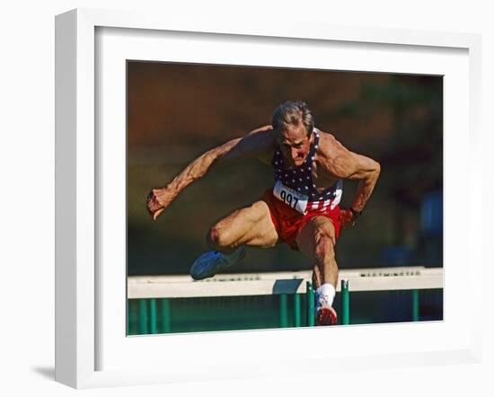 Mature Athlete Competes in Hurdles Race, Atlanta, Georgia, USA-Paul Sutton-Framed Photographic Print