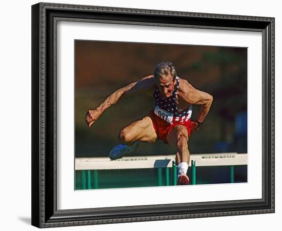 Mature Athlete Competes in Hurdles Race, Atlanta, Georgia, USA-Paul Sutton-Framed Photographic Print