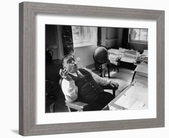 Mayor Fiorello LaGuardia Blowing Smoke Rings Sitting at Desk in His Office-William C^ Shrout-Framed Photographic Print