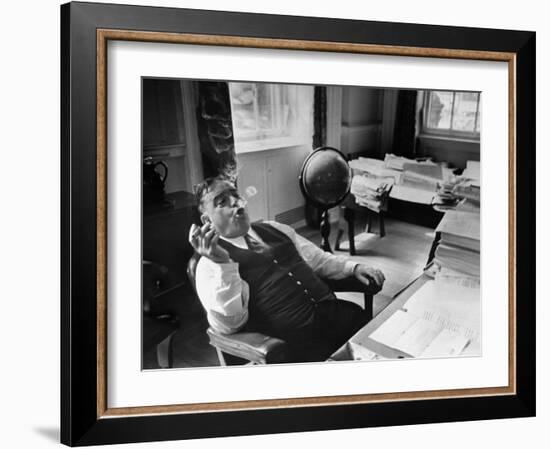 Mayor Fiorello LaGuardia Blowing Smoke Rings Sitting at Desk in His Office-William C^ Shrout-Framed Photographic Print