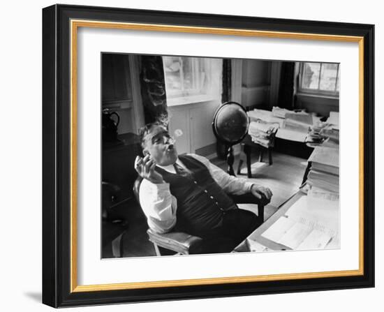 Mayor Fiorello LaGuardia Blowing Smoke Rings Sitting at Desk in His Office-William C^ Shrout-Framed Photographic Print