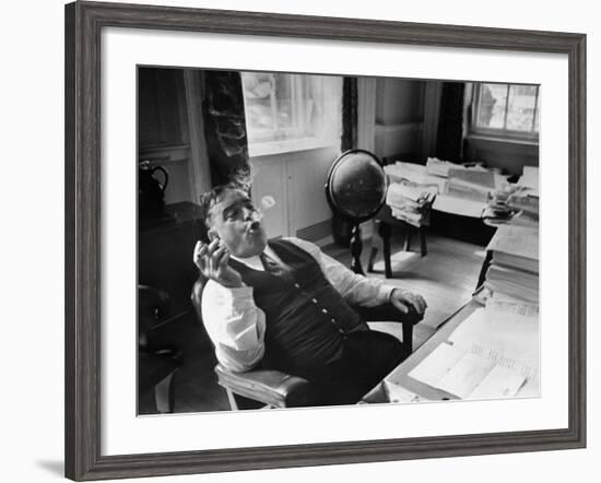 Mayor Fiorello LaGuardia Blowing Smoke Rings Sitting at Desk in His Office-William C^ Shrout-Framed Photographic Print