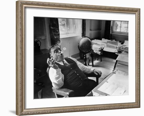 Mayor Fiorello LaGuardia Blowing Smoke Rings Sitting at Desk in His Office-William C^ Shrout-Framed Photographic Print