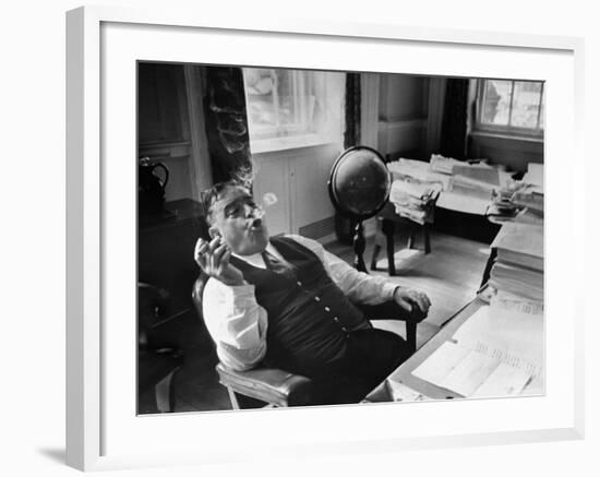 Mayor Fiorello LaGuardia Blowing Smoke Rings Sitting at Desk in His Office-William C^ Shrout-Framed Photographic Print