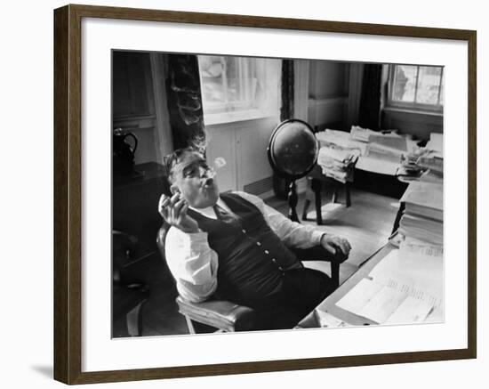 Mayor Fiorello LaGuardia Blowing Smoke Rings Sitting at Desk in His Office-William C^ Shrout-Framed Photographic Print