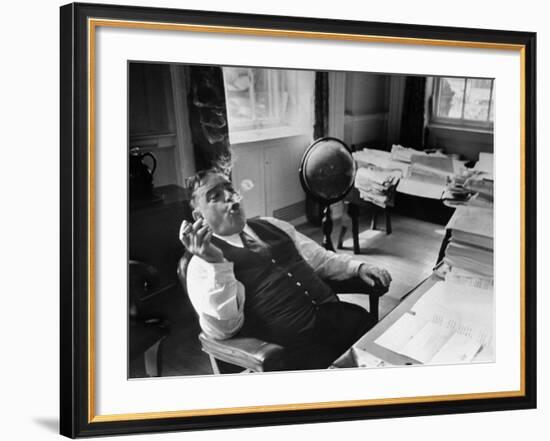 Mayor Fiorello LaGuardia Blowing Smoke Rings Sitting at Desk in His Office-William C^ Shrout-Framed Photographic Print