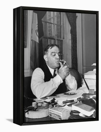 Mayor Fiorello LaGuardia Using Lighter to Light His Cigar While Sitting at His Desk in His Office-William C^ Shrout-Framed Premier Image Canvas