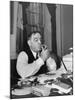 Mayor Fiorello LaGuardia Using Lighter to Light His Cigar While Sitting at His Desk in His Office-William C^ Shrout-Mounted Premium Photographic Print