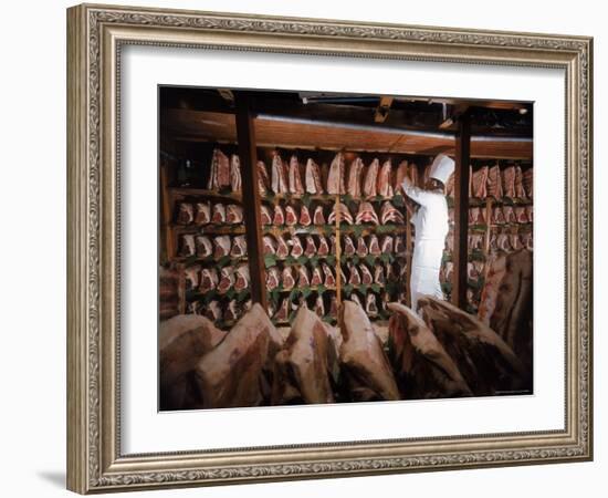 Meat Industry in the USA, Rib Roasts on Shelves and Butcher Making a Selection or Choice-Ralph Crane-Framed Photographic Print