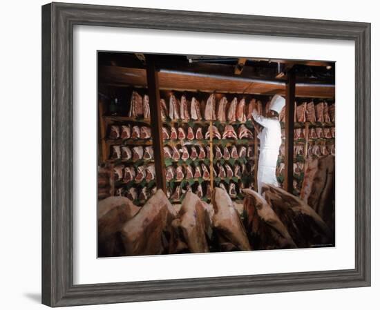 Meat Industry in the USA, Rib Roasts on Shelves and Butcher Making a Selection or Choice-Ralph Crane-Framed Photographic Print