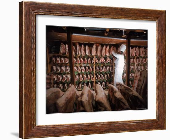 Meat Industry in the USA, Rib Roasts on Shelves and Butcher Making a Selection or Choice-Ralph Crane-Framed Photographic Print