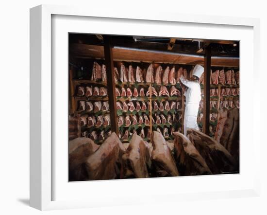 Meat Industry in the USA, Rib Roasts on Shelves and Butcher Making a Selection or Choice-Ralph Crane-Framed Photographic Print