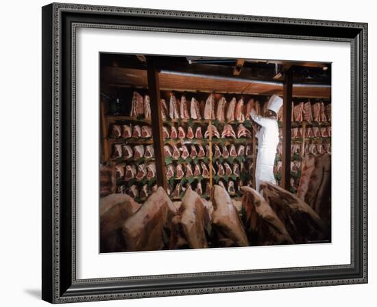 Meat Industry in the USA, Rib Roasts on Shelves and Butcher Making a Selection or Choice-Ralph Crane-Framed Photographic Print