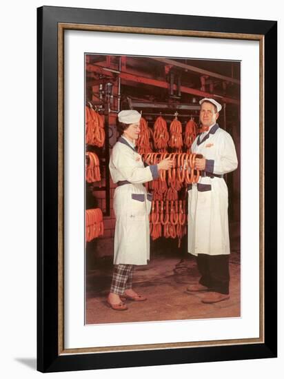 Meatpackers Checking Sausages-null-Framed Art Print