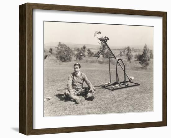 Mechanical Golfer About to Hit Golf Ball Off Man's Head-null-Framed Photo