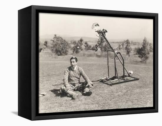 Mechanical Golfer About to Hit Golf Ball Off Man's Head-null-Framed Stretched Canvas