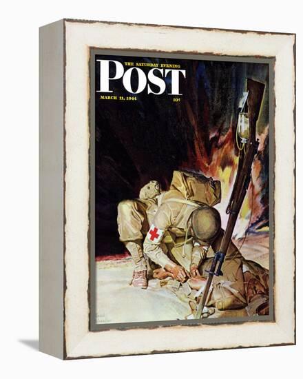 "Medic Treating Injured in Field," Saturday Evening Post Cover, March 11, 1944-Mead Schaeffer-Framed Premier Image Canvas