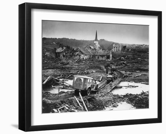 Medics' Ambulance Truck Driving Through Wreckage Left Behind at Battle Site During WWII-null-Framed Photographic Print