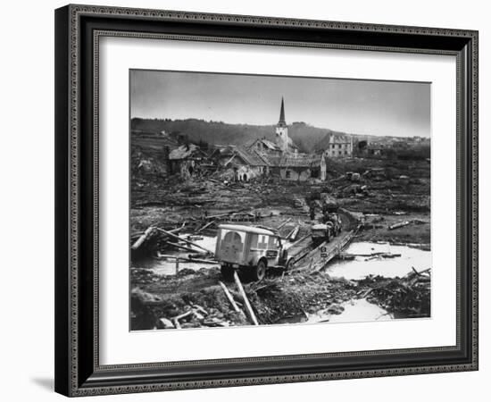 Medics' Ambulance Truck Driving Through Wreckage Left Behind at Battle Site During WWII-null-Framed Photographic Print