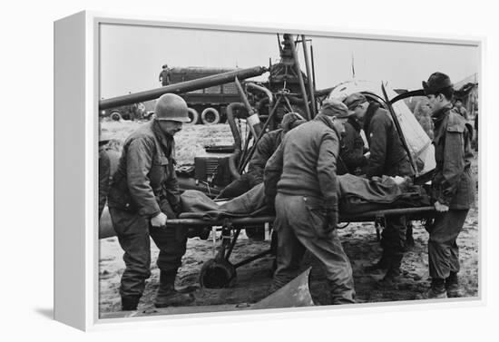 Medics Carry a Wounded U.S. Soldier Away from a Rescue Helicopter-null-Framed Stretched Canvas