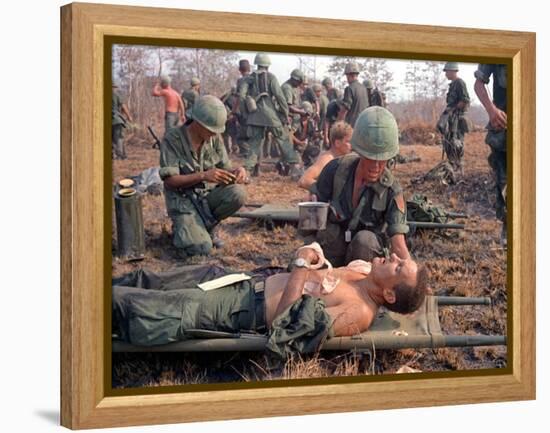 Medics Treat Wounded-Associated Press-Framed Premier Image Canvas