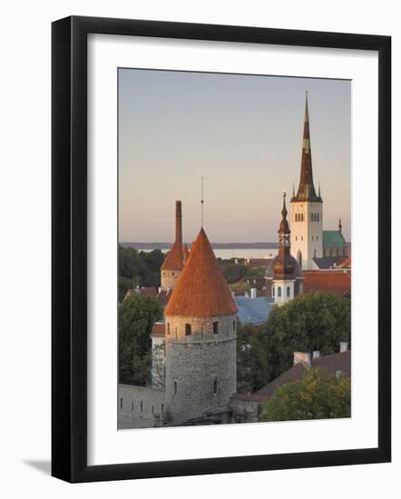 Medieval Town Walls and Spire of St. Olav's Church at Dusk, Tallinn, Estonia, Baltic States-Neale Clarke-Framed Photographic Print