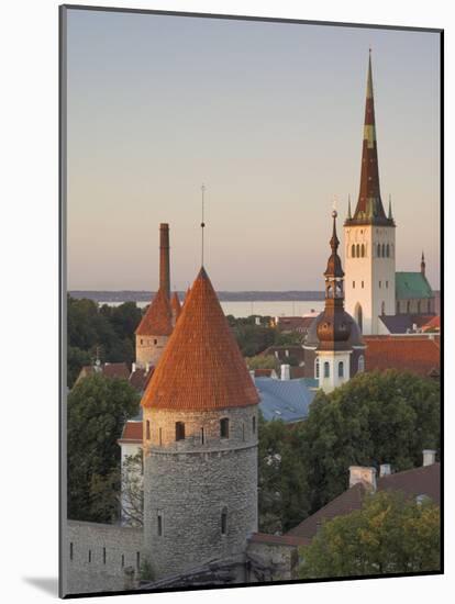 Medieval Town Walls and Spire of St. Olav's Church at Dusk, Tallinn, Estonia, Baltic States-Neale Clarke-Mounted Photographic Print