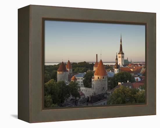 Medieval Town Walls and Spire of St. Olavs Church at Dusk, Tallinn, Estonia, Baltic States, Europe-Neale Clarke-Framed Premier Image Canvas