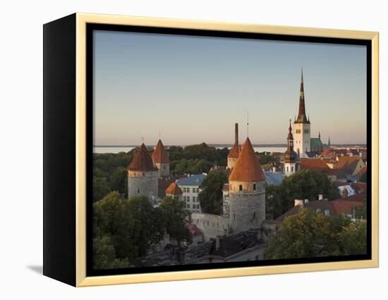 Medieval Town Walls and Spire of St. Olavs Church at Dusk, Tallinn, Estonia, Baltic States, Europe-Neale Clarke-Framed Premier Image Canvas